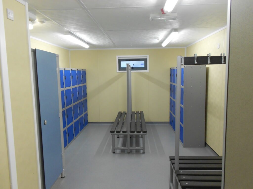 Modular sports facility interior changing room â modern and functional design Interior of a modular sports facility changing room with benches, lockers and modern finishes