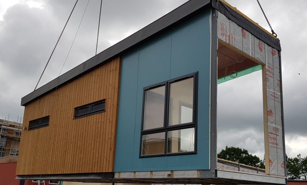 A modular unit being craned in on site